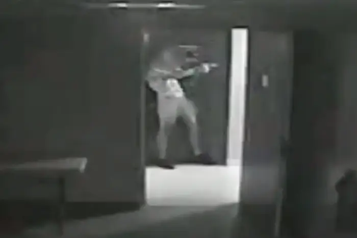 Surveillance footage allegedly showing Victor Hernandez pointing a gun at police officers